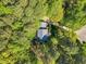 Secluded home nestled amongst mature trees, offering privacy and a serene setting at 201 Wortham Dr, Raleigh, NC 27614