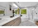 Spa-like bathroom with double vanity, soaking tub, and glass-enclosed shower for ultimate relaxation at 201 Wortham Dr, Raleigh, NC 27614