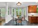 Cozy breakfast nook with a glass-top table and view of the lush outdoors at 201 Wortham Dr, Raleigh, NC 27614