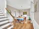 Charming dining room featuring hardwood floors, chandelier, and elegant wainscoting at 201 Wortham Dr, Raleigh, NC 27614