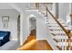 Elegant foyer with hardwood floors, staircase, and neutral tones, creating a welcoming entrance at 201 Wortham Dr, Raleigh, NC 27614