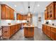 Well-equipped kitchen with custom cabinets, tile floors, and granite countertops at 201 Wortham Dr, Raleigh, NC 27614