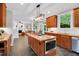 Open kitchen featuring an island cooktop, granite counters, and stainless steel appliances at 201 Wortham Dr, Raleigh, NC 27614