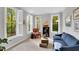 Comfortable living room with large windows, shutters, and bright natural light at 201 Wortham Dr, Raleigh, NC 27614