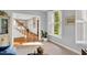 Bright living room featuring white trim, shuttered windows, and hardwood floors at 201 Wortham Dr, Raleigh, NC 27614