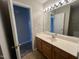 Bathroom with vanity, light fixture, and access to other rooms at 247 Anna St, Lillington, NC 27546