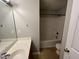 Bathroom featuring a single vanity and a shower-tub combo at 247 Anna St, Lillington, NC 27546
