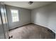 Comfortable bedroom with neutral walls, carpeted floor, and window at 247 Anna St, Lillington, NC 27546