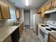 Efficient kitchen featuring a full suite of appliances and neutral countertops at 247 Anna St, Lillington, NC 27546