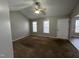 Spacious living room with a vaulted ceiling, ceiling fan, and natural light at 247 Anna St, Lillington, NC 27546
