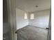 Clean bedroom with two windows for natural light at 2904 Jefferson Davis Hwy, Sanford, NC 27332