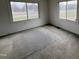 Bright bedroom with neutral walls and carpet, featuring two large windows at 2904 Jefferson Davis Hwy, Sanford, NC 27332