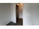 A view of a bedroom with painted walls and carpet, with an open closet door and hall access at 2904 Jefferson Davis Hwy, Sanford, NC 27332