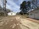 Property featuring mature trees and an outbuilding in the backyard at 2904 Jefferson Davis Hwy, Sanford, NC 27332
