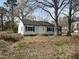 Traditional one-story home with white siding, a brick foundation, and a well-manicured front yard at 2904 Jefferson Davis Hwy, Sanford, NC 27332