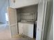 A utility closet containing a washer, dryer, and water heater at 2904 Jefferson Davis Hwy, Sanford, NC 27332