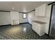 Cozy living room featuring a whitewashed fireplace and convenient access to storage cabinets at 2904 Jefferson Davis Hwy, Sanford, NC 27332