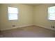Well-lit bedroom with carpeting, large windows, and ample electrical outlets at 313 Main St, Knightdale, NC 27545