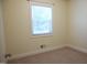 Comfortable bedroom with natural light, soft carpeting, and a serene atmosphere at 313 Main St, Knightdale, NC 27545