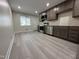 Updated kitchen showcasing modern stainless steel appliances, ample cabinet space, and new flooring at 313 Main St, Knightdale, NC 27545