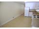 Bright kitchen featuring white cabinetry and appliances, offering plenty of space at 313 Main St, Knightdale, NC 27545