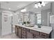 Spa-like bathroom with double vanity, walk-in shower, and modern fixtures offers a luxurious and relaxing experience at 323 Augusta Pond Way # 171, Raleigh, NC 27603