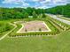 Aerial view of the community dog park area including perimeter walking path and benches at 323 Augusta Pond Way # 171, Raleigh, NC 27603