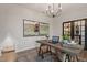Stylish home office featuring a rustic desk, decor, and built-in dog bed provides a cozy and productive workspace at 323 Augusta Pond Way # 171, Raleigh, NC 27603