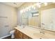 Bathroom with a double sink vanity, a large mirror, and good lighting at 3316 Perkins Ridge Rd, Raleigh, NC 27610