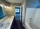 Bathroom featuring double sinks and a tub/shower combo at 3316 Perkins Ridge Rd, Raleigh, NC 27610