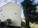 Exterior shot of the back of the home, showing siding and mature trees at 3316 Perkins Ridge Rd, Raleigh, NC 27610