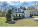 Beautiful home featuring a landscaped yard and classic architectural details, creating a welcoming ambiance at 3316 Perkins Ridge Rd, Raleigh, NC 27610