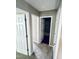 Hallway showcasing multiple doorways and neutral carpeting at 3316 Perkins Ridge Rd, Raleigh, NC 27610