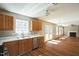 Spacious kitchen with modern appliances, white countertops, and seamless flow to the living area at 3316 Perkins Ridge Rd, Raleigh, NC 27610