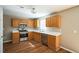Well-lit kitchen with stainless steel appliances, ample cabinet space, and modern countertops at 3316 Perkins Ridge Rd, Raleigh, NC 27610