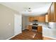 Bright kitchen features stainless steel appliances, light countertops, and warm wood cabinets at 3316 Perkins Ridge Rd, Raleigh, NC 27610
