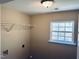 Laundry room featuring a window and wire shelving at 3316 Perkins Ridge Rd, Raleigh, NC 27610