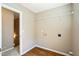 Empty laundry room featuring hardwood flooring and a wire shelf on the wall at 3316 Perkins Ridge Rd, Raleigh, NC 27610