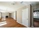Spacious living room featuring hardwood floors, a fireplace, and access to other rooms at 3316 Perkins Ridge Rd, Raleigh, NC 27610