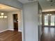 Open-concept living space with hardwood floors and views of the kitchen and dining area at 3316 Perkins Ridge Rd, Raleigh, NC 27610