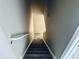 Carpeted staircase with white railing leading to the upper level of the home at 3316 Perkins Ridge Rd, Raleigh, NC 27610