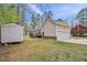 Exterior of the home features a backyard with deck, detached shed, and garage at 340 Castleberry Rd, Clayton, NC 27527