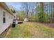 View of the house showing a deck, propane tank, air conditioner, and shed at 340 Castleberry Rd, Clayton, NC 27527