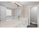 Bright bathroom featuring a long vanity with a white countertop, tub, and a mirror at 340 Castleberry Rd, Clayton, NC 27527