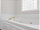 Close-up of a white jacuzzi tub at 340 Castleberry Rd, Clayton, NC 27527