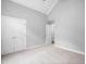 Spacious bedroom with light gray walls, carpet floors, double closets, and a vaulted ceiling at 340 Castleberry Rd, Clayton, NC 27527