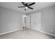 Bedroom with light gray walls, carpet floors and double closets at 340 Castleberry Rd, Clayton, NC 27527