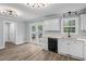 Bright kitchen with white cabinets, gray walls, and stainless steel sink overlooking the back yard at 340 Castleberry Rd, Clayton, NC 27527
