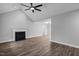 Bright and airy living room featuring vaulted ceilings, a modern ceiling fan, and wood-look flooring at 340 Castleberry Rd, Clayton, NC 27527