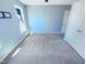 Carpeted bedroom with a fan and two doors, featuring natural light from the window at 357 Riverwood Dr, Clayton, NC 27527